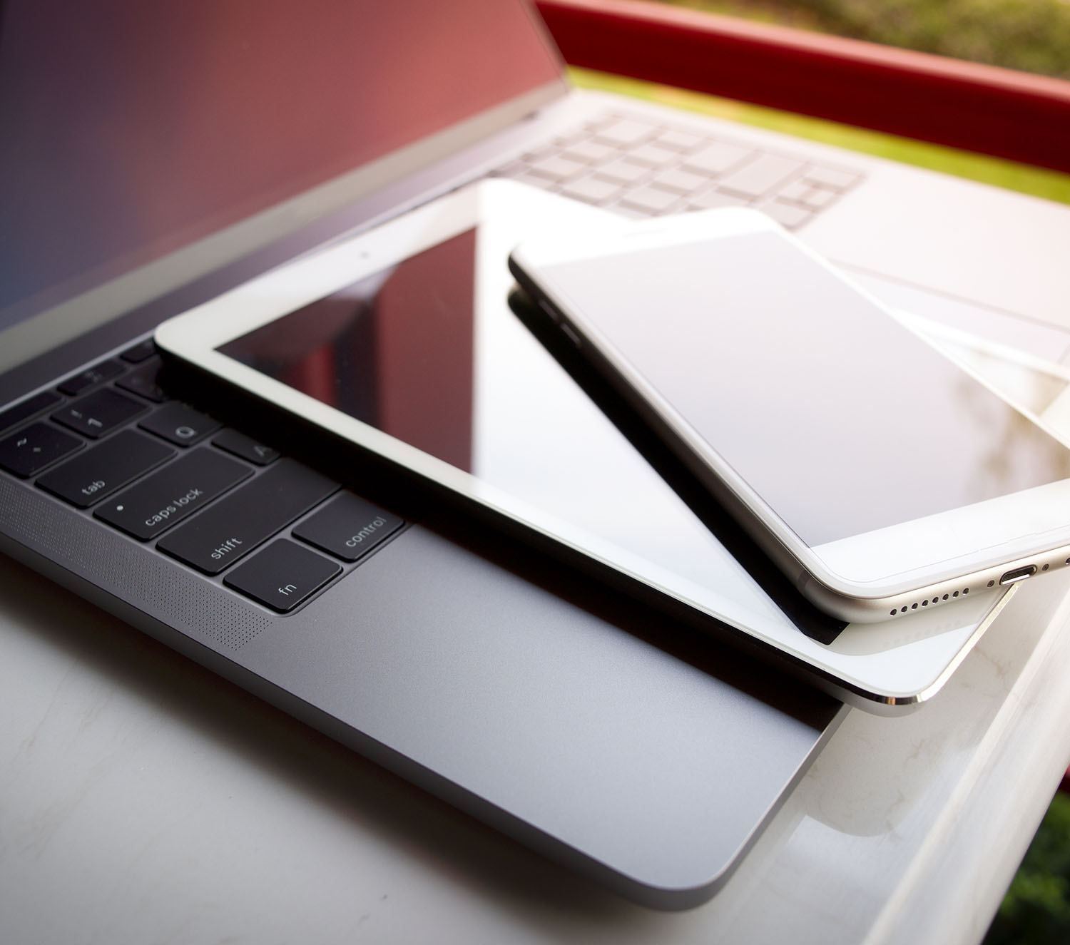 laptop mobile and table on top of each other
